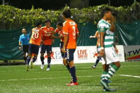 NUDGING AHEAD: Albirex Niigata&#039;s (in orange) win over Geylang International (in stripes) last night gives the White Swans a seven-point lead over second-placed Tampines, with four games left.