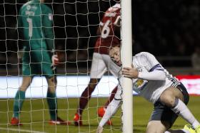 BROUGHT TO HIS KNEES: Wayne Rooney rues yet another missed opportunity in the League Cup clash against Northampton.