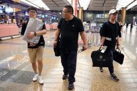 GOING HOME: (From left) Mr Byeon Dae Seung, Captain Kwon Do and Mr Kim Seon Kuk at Changi Airport.