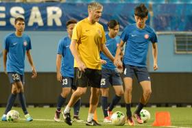 BRIGHT PROSPECT: Garena Young Lions coach Patrick Hesse (in yellow) singled out Joshua Pereira (far right) as an example of a budding talent coming through the ranks. 