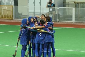 UNEXPECTED: Malaysia (above) celebrate an unlikely 2-0 win over tournament favourites Japan.