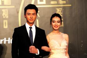 TVB actress Tracy Chu (right) juggles law school and acting, and appeared on the red carpet of the StarHub TVB Awards 2016 with actor Vincent Wong (left). 