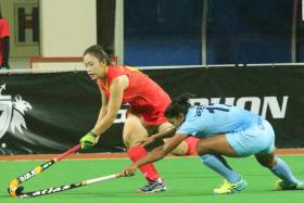 FITTING FINALE: India (in blue) overcoming China to win the Women&#039;s Asian Champions Trophy last night.
