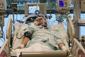 UNCONSCIOUS: Mr Lim Chwee Leong was operated on immediately upon reaching the hospital as a blood clot had formed in his brain following his fall on an escalator at Bishan MRT station.