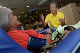 SHOCKED: Dialysis patient Joseph Chan (right) broke down in tears when he heard the news of Mr Edmund Kwok&#039;s sacking. 