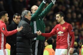 Henrikh Mkhitaryan shakes Jose Mourinho&#039;s hand as he is substituted in Manchester United&#039;s Europa League match against Feyenoord.