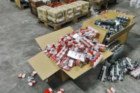 The duty-unpaid cigarettes which were retrieved from the modified bed headboards and packed into boxes in the warehouse at Loyang Crescent. Three Singaporeans and one Indonesian were charged in the State Courts on 11 June 2015 for their involvement in contraband cigarette activities. Singapore Customs and the ICA found duty-unpaid cigarettes hidden in hollow spaces of the specially modified headboards. 