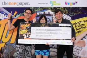 Mr Foo Jit Soon (left) and Miss Kong Cherlynn (middle) receive their prize from TNP editor Eugene Wee.