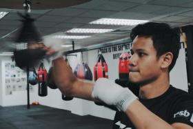 Singapore&#039;s first World Champion professional boxer, Muhamad Ridhwan