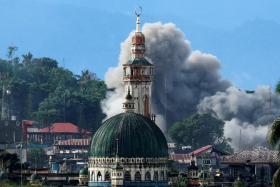 An explosion is seen following a Philippine Army airstrike as government troops continue their assault against insurgents from the Maute group in Marawi city, Philippines June 29, 2017. 