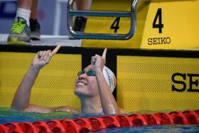 Swimmer Roanne Ho celebrates after winning the SEA Games women&#039;s 50m breaststroke final.
