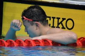 Francis Fong celebrates after winning silver in the SEA Games 200m backstroke final.