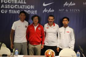 Hong Kong coach Kim Pan Gon (second from left), seen here with Hong Kong defender Lau Hok Ming, Singapore youth coach Richard Tardy and Singapore footballer Adam Swandi at a pre-match press conference on 19 July 2016, is a fan of Singapore football&#039;s youth set-up.
