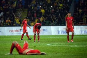 The Singapore’s national Under-22 players looking crestfallen after the final whistle in their 2-1 defeat by Malaysia in the SEA Games Group A football match at Shah Alam Stadium in Malaysia.