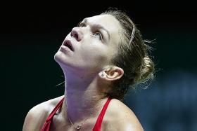 Halep thrashed by Wozniacki