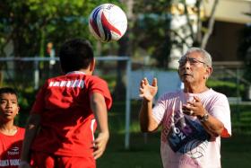 Majid Ariff (right), whom Fandi Ahmad once hailed as the most skilful Singaporean footballer, was active as a coach even during his twilight years. 