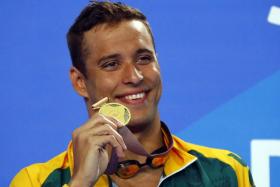 Chad le Clos with his gold medal in the men's 50m freestyle.
