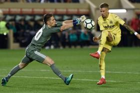 Luca Zidane (left) trying to stop Villarreal's Samuel Castillejo.