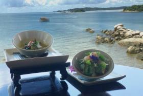 Gaeng Kiew Wan Gai (left) and  Yum Pla Salmon by Chef Porntip Eumanan at the Taste of Thailand event at Banyan Tree Bintan