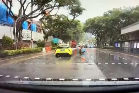 Taxi hits pedestrian after beating red light in Penang Road