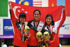 (From left) Singapore bowlers Joey Yeo, Daphne Tan and Bernice Lim celebrating their bronze-medal win in the women’s trios event. 