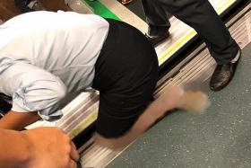 Woman&#039;s leg gets stuck in platform gap at Buona Vista MRT station