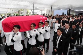 A state flag draped over the casket of late actor Aloysius Pang during his militart funeral.