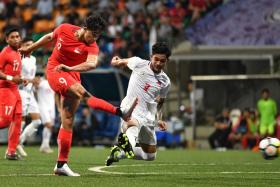 Singapore striker Ikhsan Fandi attempting a shot at goal against the Philippines.