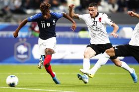 France's Kingsley Coman (left) opening the scoring against Albania.