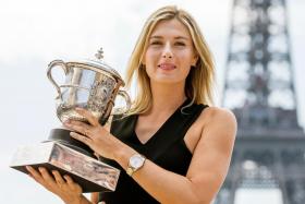 Maria Sharapova with her 2014 French Open trophy, the fifth and last of her Grand Slam triumphs.