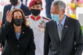 US Vice-President Kamala Harris is welcomed by Prime Minister Lee Hsien Loong at the Istana yesterday. 