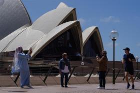 Visitors to the Sydney Opera House last week following months-long lockdown.
Singapore residents looking to head to Australia for leisure will have to possibly wait until
December for a two-way trip without quarantine. 