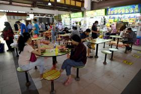 Checks on the vaccination status of diners at hawker centres are being done selectively by safe distancing enforcement officers.