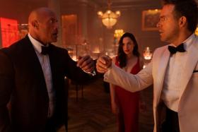 US actor Dwayne Johnson, Israeli actress Gal Gadot and Canadian actor Ryan Reynolds star in Netflix’s big-budget Red Notice, which premieres here on Nov 12.