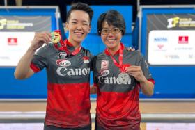 Singapore bowlers Shayna Ng (left) and Cherie Tan showing with their gold and silver medals respectively at the IBF Super World Championship.