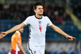 Harry Maguire celebrates scoring England’s first goal during their 10-0 win over San Marino. 