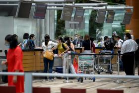 Many in Singapore are set to go ahead with travel plans while travel agencies report no impact on sales or cancellations despite the new virus variant. 