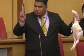 The Malaysian state legislator spiced up a speech on poultry prices with some real meat.
