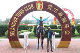 Former jockey V Sivan leading Best Bay, his first winner as a trainer in Kuala Lumpur on Saturday. His charge was ridden by apprentice R Nuqman.