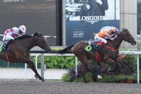 Jockey A’Isisuhairi Kasim completing his hat-trick of wins on Entertainer, who beat Ararat Lady in the penultimate race on Saturday.