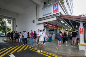 People queueing at Singapore Pools authorised retailer Tong Aik Huat in Hougang Street 61 on Feb 11, 2022.