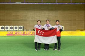 (From left) Ms Teh Xiu Hong, Ms Teo Shun Xie and Ms Nicole Tan in the ISSF World Cup 25m pistol women’s team event in Cairo, Egypt on March 6, 2022. 
