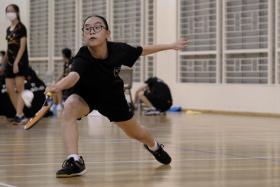Xinmin Sec&#039;s Anne Wong kept it close in her encounter with Tricia Hu from SCGS in the girls&#039; B Division North Zone badminton final at Canberra Secondary on April 26, 2022. SCGS won 5-0 to clinch the title. 