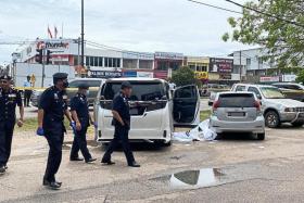 Police looking for clues at the crime scene in Taman Intan, Sungai Petani.
