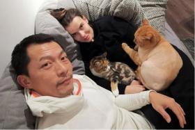 Ix Shen with his Ukrainian wife Natalia and two of their four cats. PHOTO: IX SHEN