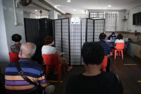 Voluntary tuberculosis screening being conducted for residents and business owners in Block 2 Jalan Bukit Merah last month. 