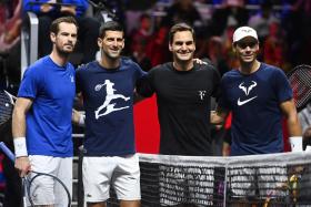 Britain's Andy Murray, Serbia's Novak Djokovic, Switzerland's Roger Federer and Spain's Rafael Nadal pose for photographs during a practice session of team Europe in London ahead of the Laver Cup tennis tournament. 