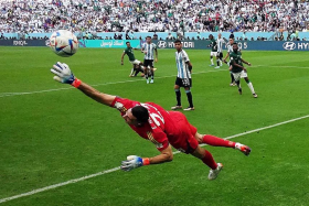 Saudi Arabia&#039;s Salem Al-Dawsari scoring their second goal past Argentina&#039;s Emiliano Martinez during their World Cup match on Nov 22, 2022. 
