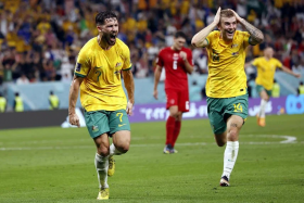 Australia&#039;s Mathew Leckie (left) celebrates with teammate Riley McGree after scoring in the 1-0 win over Denmark in their final Group D match on Wednesday. They will meet the Group C winners in the round of 16. 