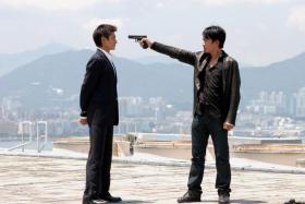 Andy Lau (left) and Tony Leung Chiu Wai square off in Infernal Affairs.